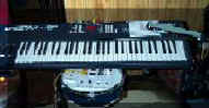 Cheeta 5 octave, 8 zone, 4 layer Master Series MIDI Keyboard Controller, with light switch drum below and PoleKAT dual zone trigger pad to right